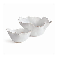 Two white ceramic bowls with ruffled edges on a white background