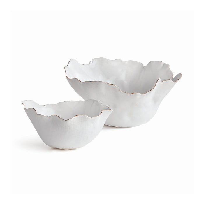 Two white ceramic bowls with ruffled edges on a white background