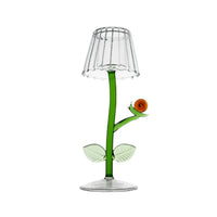 Decorative glass tealight lamp shaped like a flower with a clear glass shade on a white background