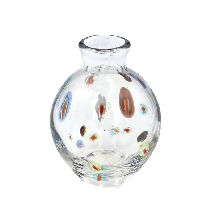 Clear glass vase with multicolored speckles on a white background