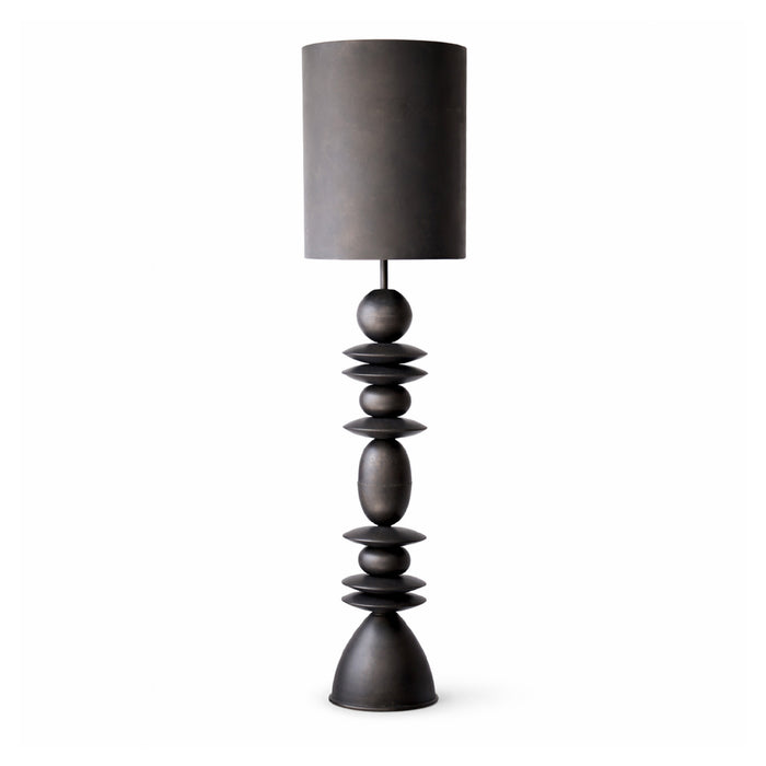 Dark gray table lamp with a cylindrical shade on a white background