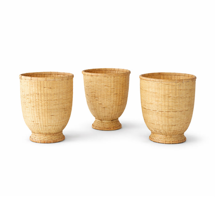 Three woven baskets of different sizes on a white background