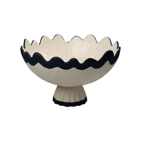 Decorative bowl with wavy rim and pedestal base on a white background