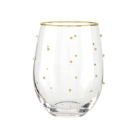 Clear glass with gold rim and gold polka dots on a white background
