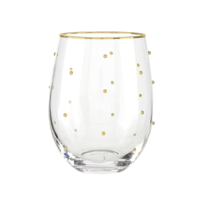Clear glass with gold rim and gold polka dots on a white background