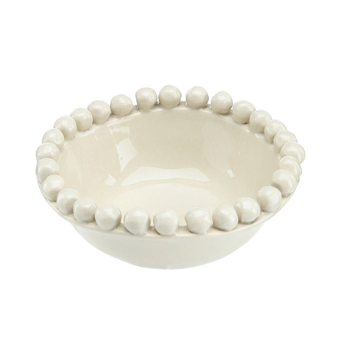 Off White ceramic bowl with bead-like embellishments on a white background