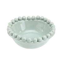 Light blue ceramic bowl with bead-like embellishments on a white background