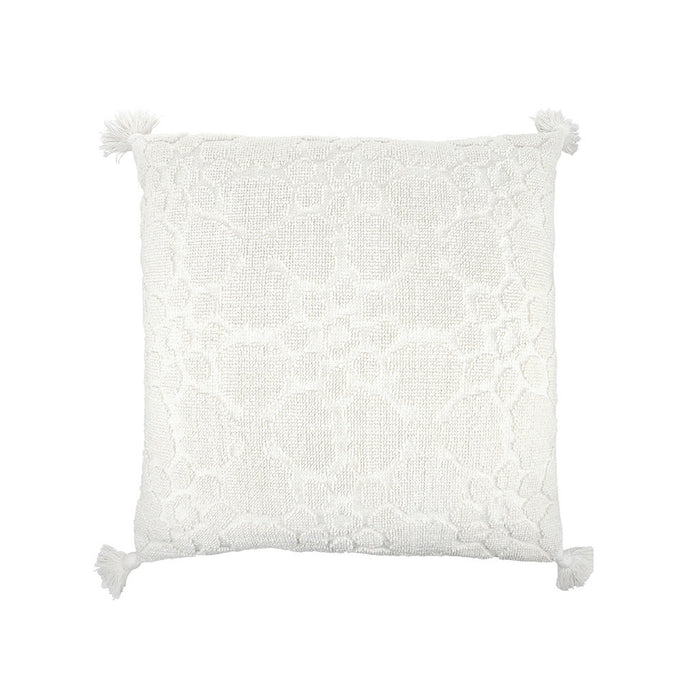 White textured pillow with tassels on a white background