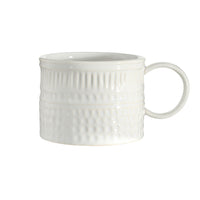 White textured mug on a white background