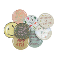 Set of colorful plates with humorous sayings on a white background