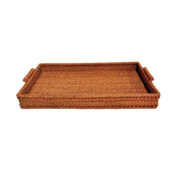 Woven brown rattan tray with handles on a white background