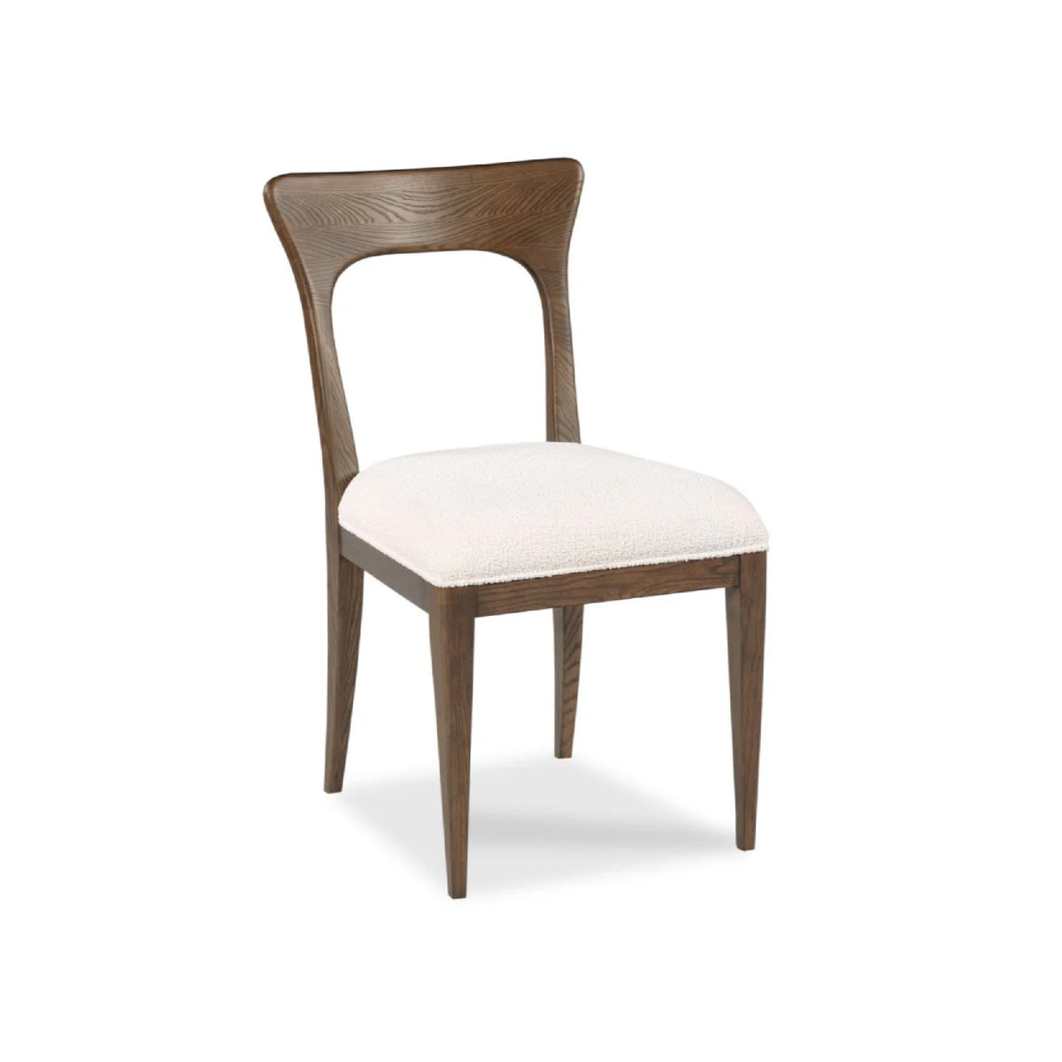 Millback Dining Chair by Woodbridge Furniture features a light cushion, curved backrest, and tapered legs for modern style.