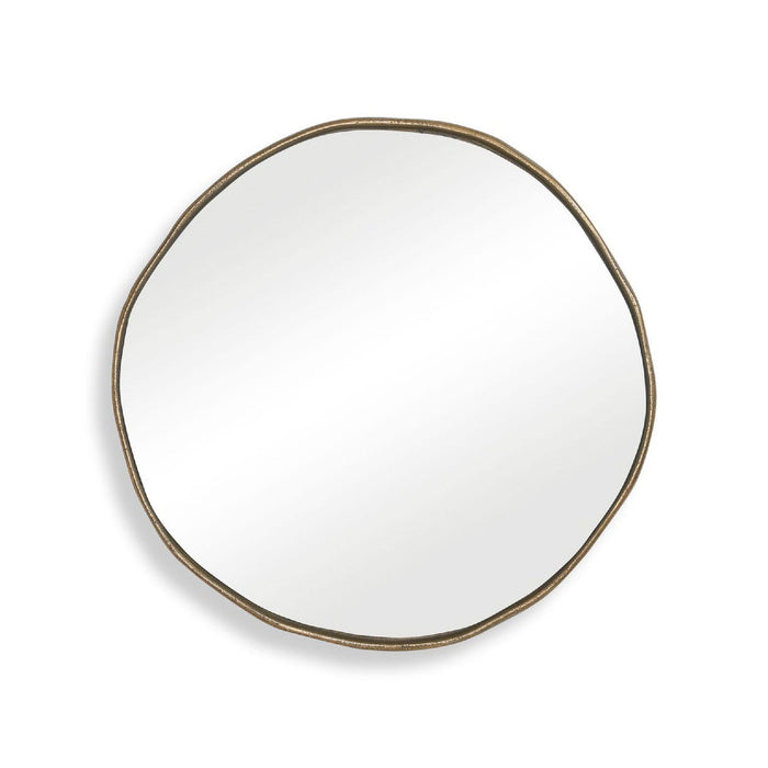 Round mirror with a gold frame on a white background