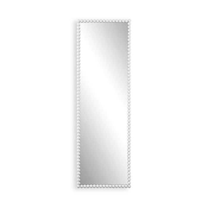 Rectangular mirror with a beaded white frame on a white background