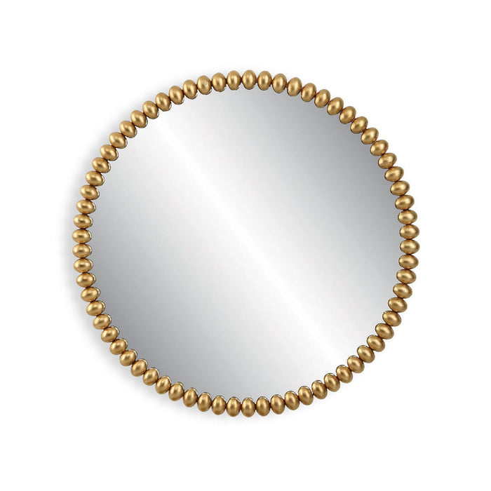 Round mirror with a gold beaded frame on a white background