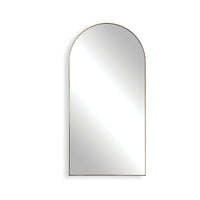 Arched mirror with a gold frame on a white background