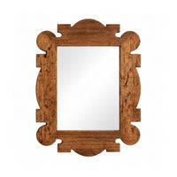 A rustic rectangular wall mirror with an ornate carved wooden frame.