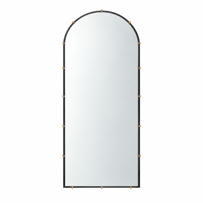 Klipp Arched Dressing Mirror with a black frame and decorative brass-finished clips.