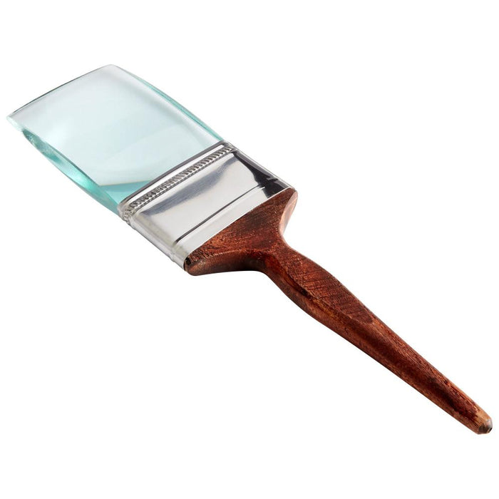 Paint brush with wooden handle and glass ferrule on a white background