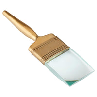 Gold-handled paintbrush with white bristle head on a white background
