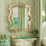 Heavy Beveled Mirror by Mirror Home, glass table decor, and green drapes in elegant room.