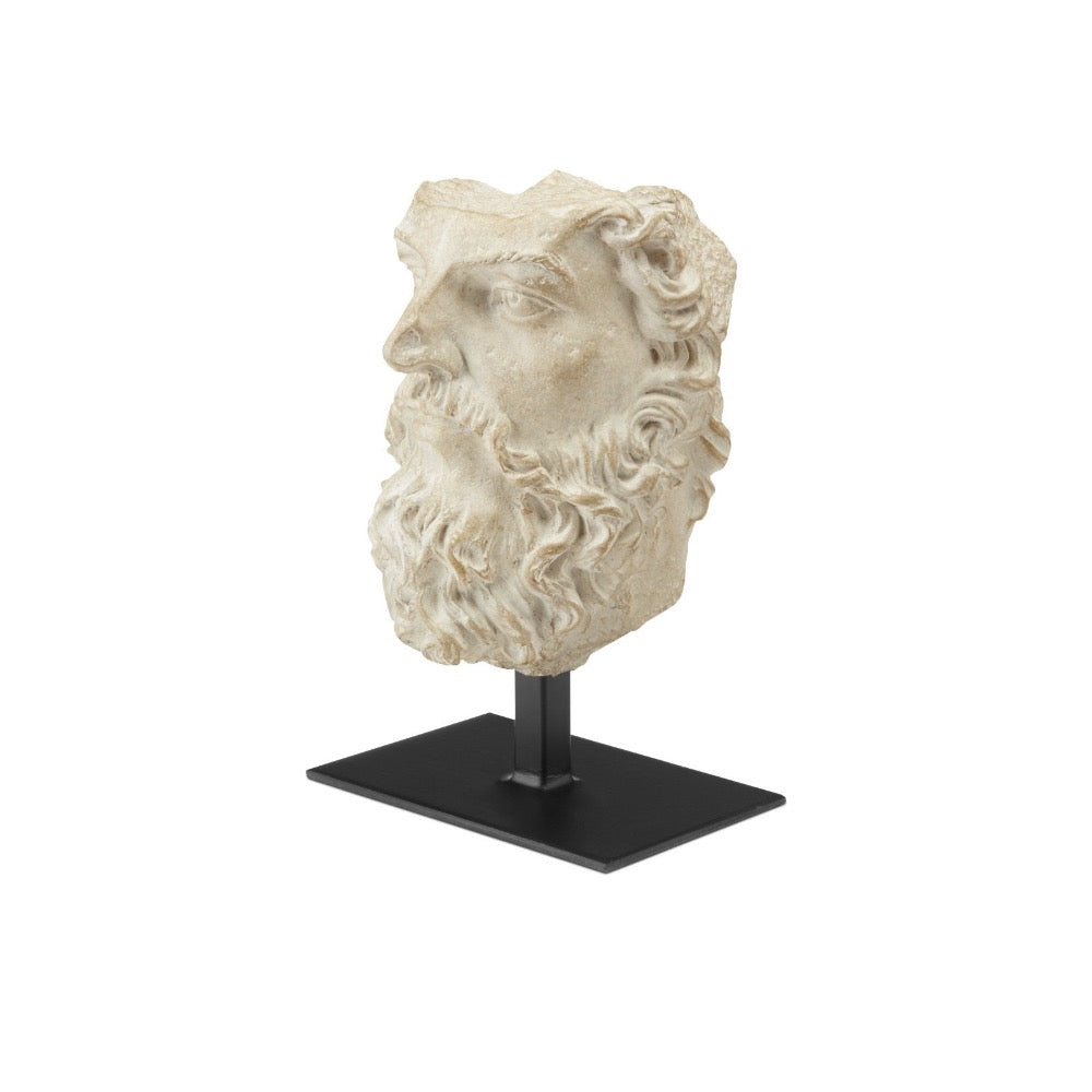 Statue head on a stand with a white background