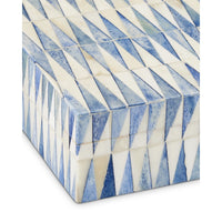 Decorative box with blue and white geometric pattern on a white background