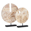 round tan marble sculpture black base