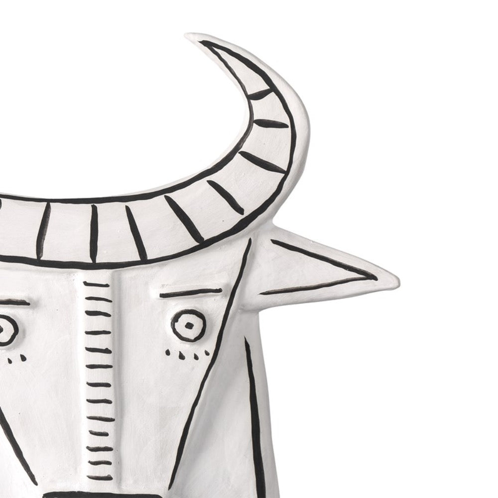 white porcelain cow sculpture open-backed black details