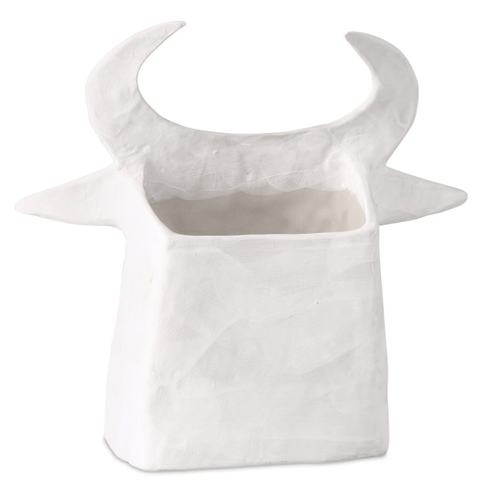 white porcelain cow sculpture open-backed black details