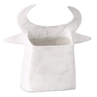 white porcelain cow sculpture open-backed black details