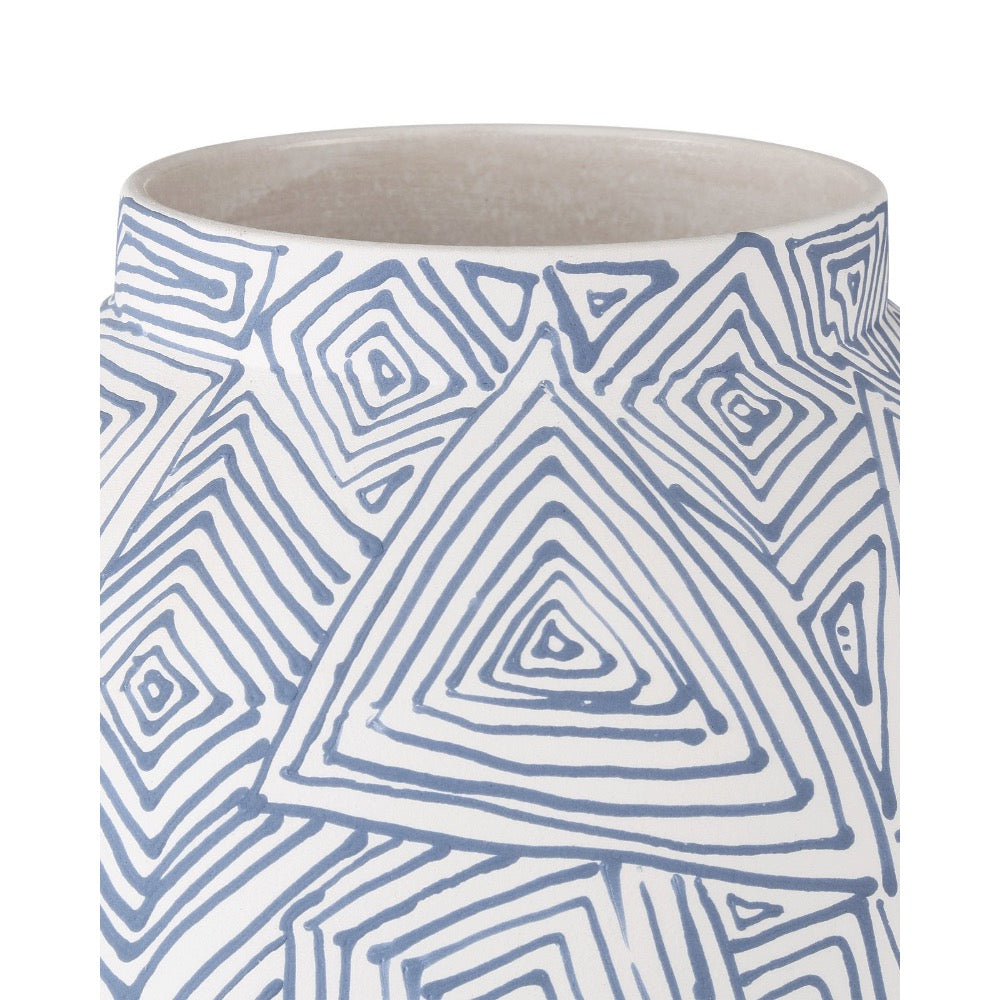 Ceramic vase with blue geometric pattern on a white background