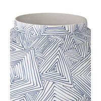 Cylindrical container with blue geometric pattern on white background
