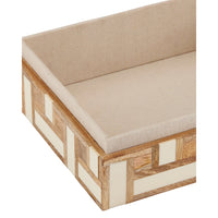 Wooden bench with beige cushion on a white background