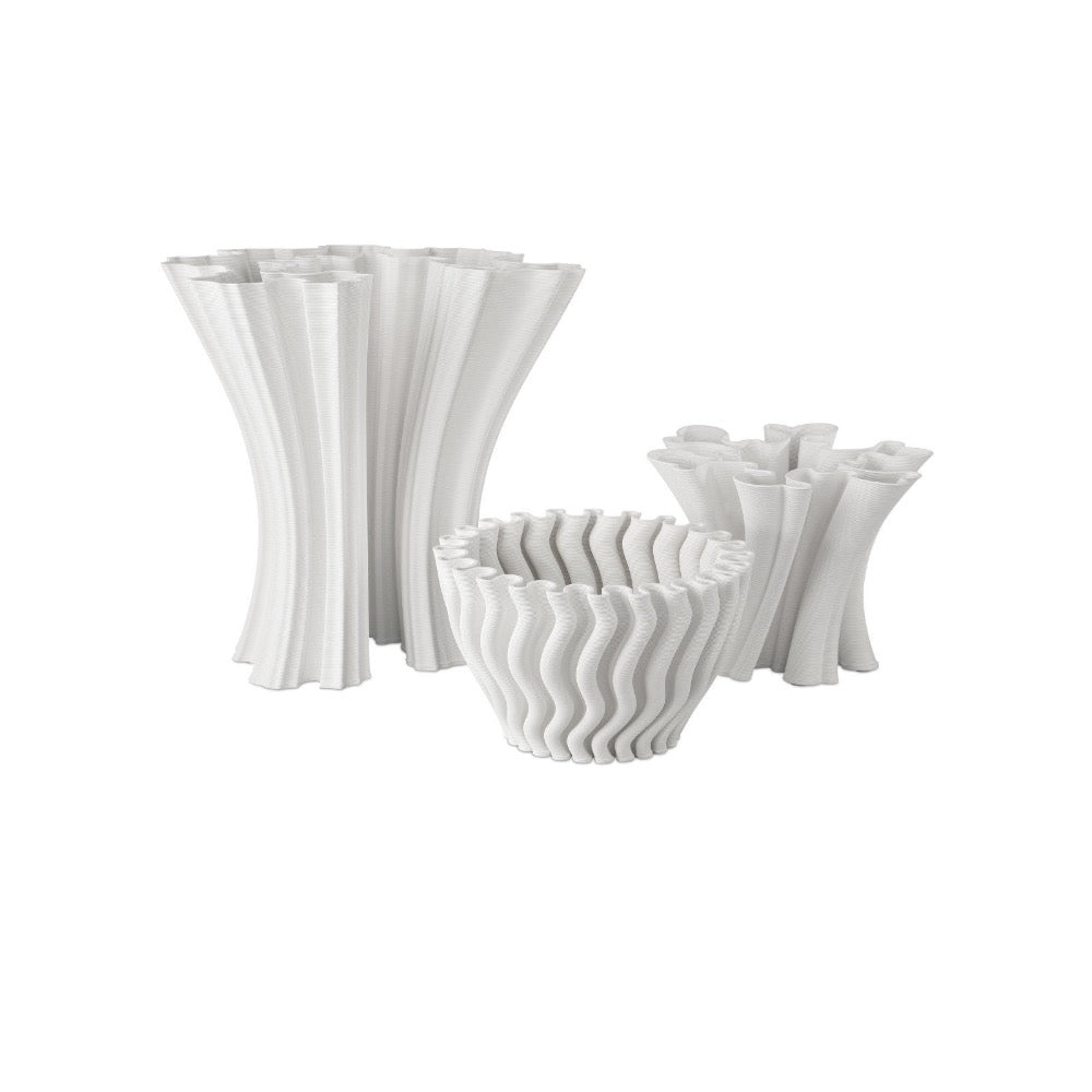 Set of white textured vases and bowls on a white background