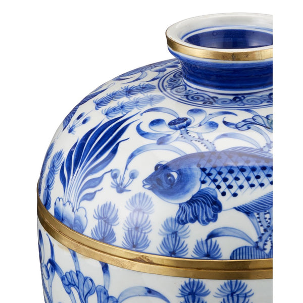 Blue and white ceramic jar with gold accents and fish design on a white background