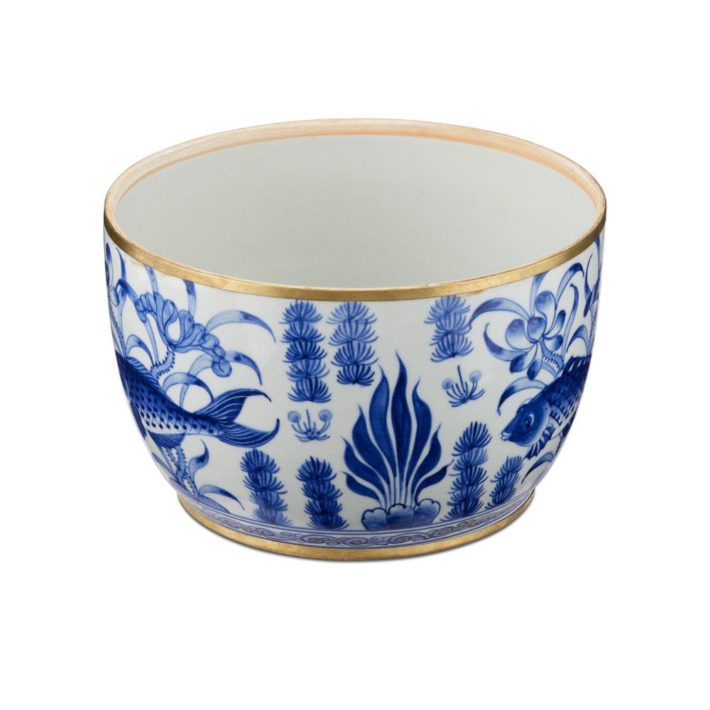 Ceramic bowl with blue floral and fish design on a white background