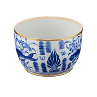 Ceramic bowl with blue floral and fish design on a white background