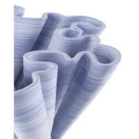 Stack of blue and white wavy paper sheets on a white background