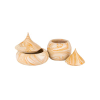 Three small decorative containers with lids made of marbled stone in cream and golden yellow swirls, shown on a plain white background.