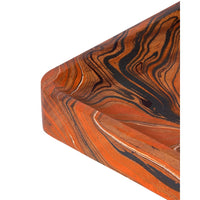 Marbled wood tray corner with swirling patterns of orange, black, and light tan wood grain.