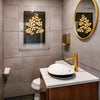 Modern bathroom with a round mirror, gold faucet, and Barloga Studios' "Golden Duck on Kozo Noire Photography Art," elegantly displayed within an archival wood frame, set against a dark background.
