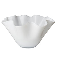 White ceramic bowl with ruffled edge on a white background