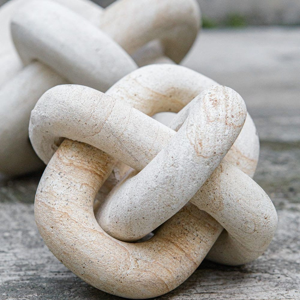 Close-up of a stone knot on a textured surface