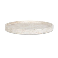 Round travertine tray on a white background