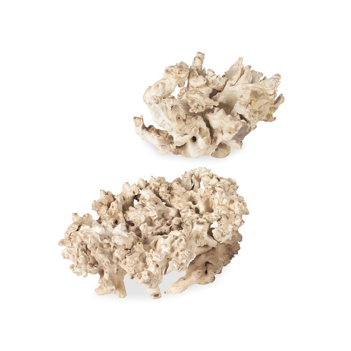 Two pieces of beige decorative sculptures on a white background