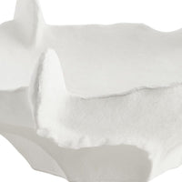 Close-up of white bowl with folds on a white background