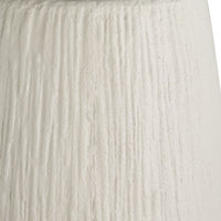 Close-up of textured white planter  with horizontal lines