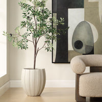 Potted plant in a modern living room with abstract art on the wall