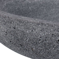 Close-up of a textured gray stone bowl